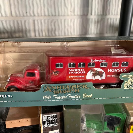 Red diecast truck with Budweiser trailer bank and horse-themed graphics