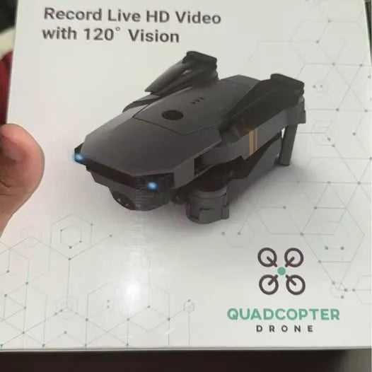 Quadcopter drone with front camera and four rotors, dark gray body.