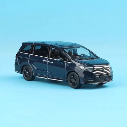 Diecast mini van toy in dark blue with front grille and headlights