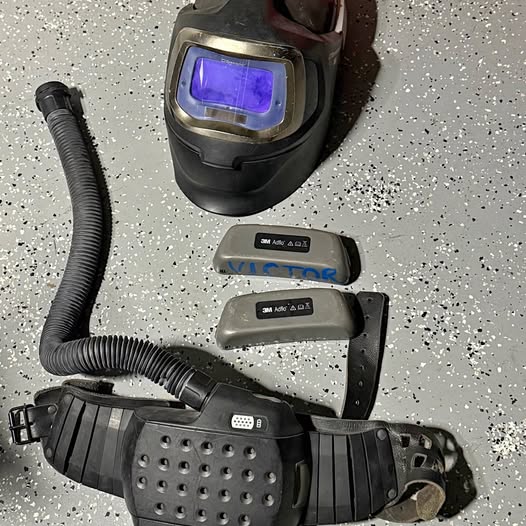3M Adflo air respirator hood with purple visor, hose, and filter units