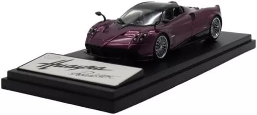 Purple diecast roadster model car on display base