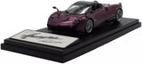 Purple diecast roadster model car on display base