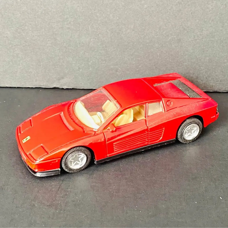 Red Ferrari Testarossa diecast sports car, pull-back and go, side view