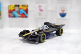 Black race car diecast toy, loose, 1:64 scale, with yellow wheels