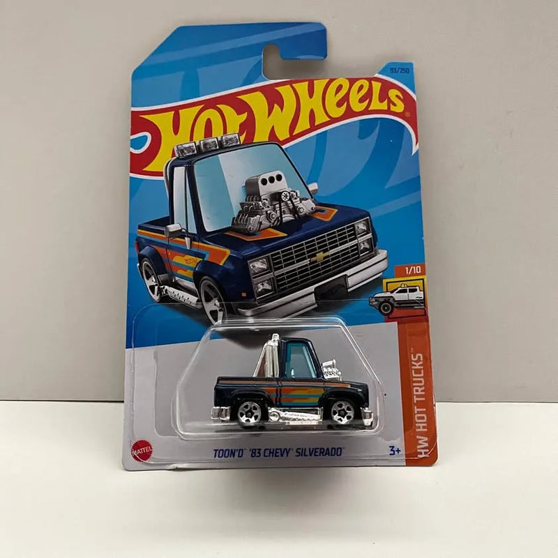 Hot Wheels diecast pickup truck with blue and orange graphics, 1/10 scale