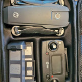 Folding drone kit with controller, spare batteries, and accessories in case
