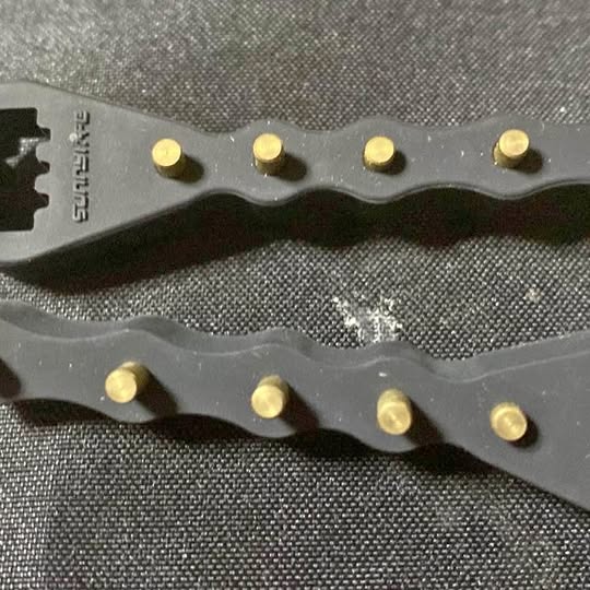 Drone antenna extender metal bracket with multiple gold fasteners and holes