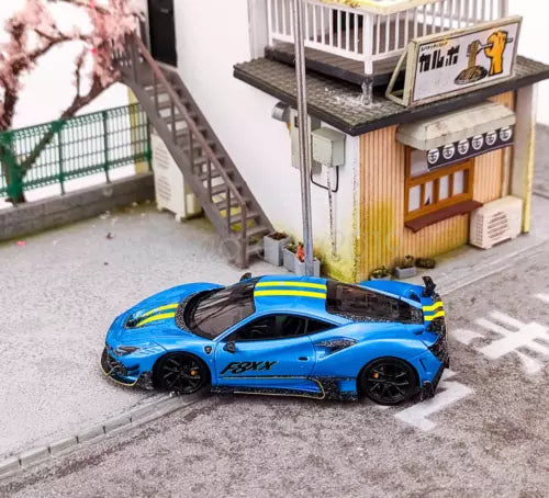 Blue racing sports diecast car with black wheels and F8XX-style side decals