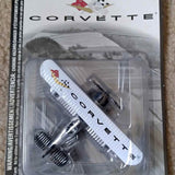 Corvette biplane diecast toy in clear blister pack, white plane with checkered tail