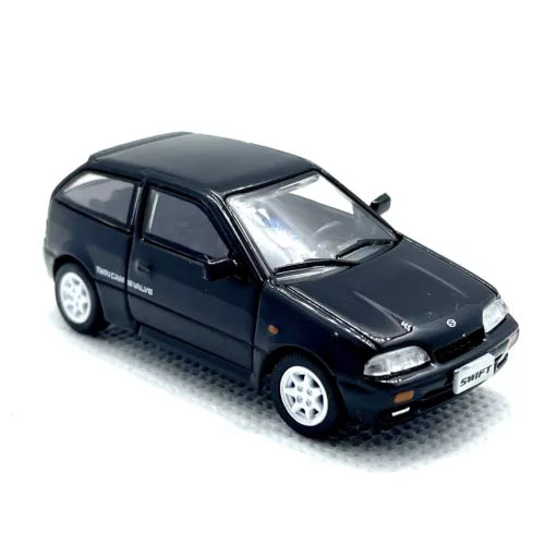 Black 1:64 diecast 1989 Suzuki Swift GTi LHD model car, front three-quarter view
