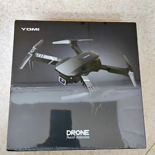 Drone box with YOMI drone illustration and foldable quadcopter image