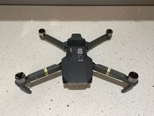 DJI Mavic Pro 4K foldable quadcopter drone with four arms and top camera, grey