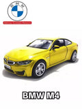 1:36 diecast BMW M4 coupe model car, yellow, front three-quarter view.