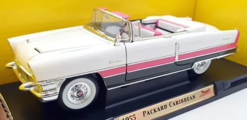 Diecast model car: white body with pink stripe, chrome grille and open top
