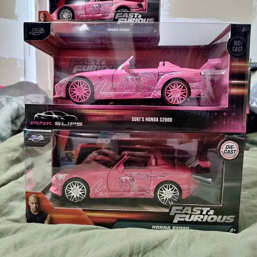 Pink Honda S2000 diecast model car in retail display box, front view