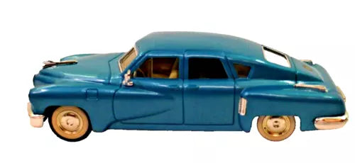 Mint diecast 1:43 scale 1948 Tucker sedan, teal-blue with tan interior