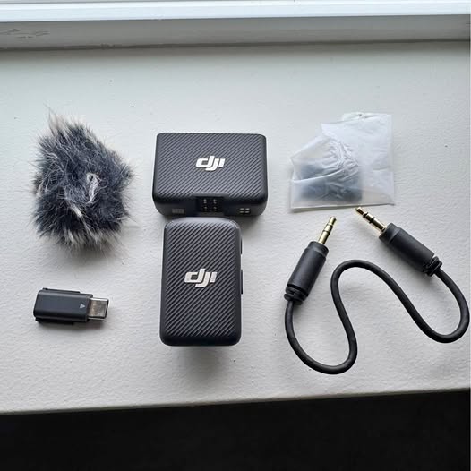 DJI mini microphone kit with windscreen, two transmitters, cables and adapters