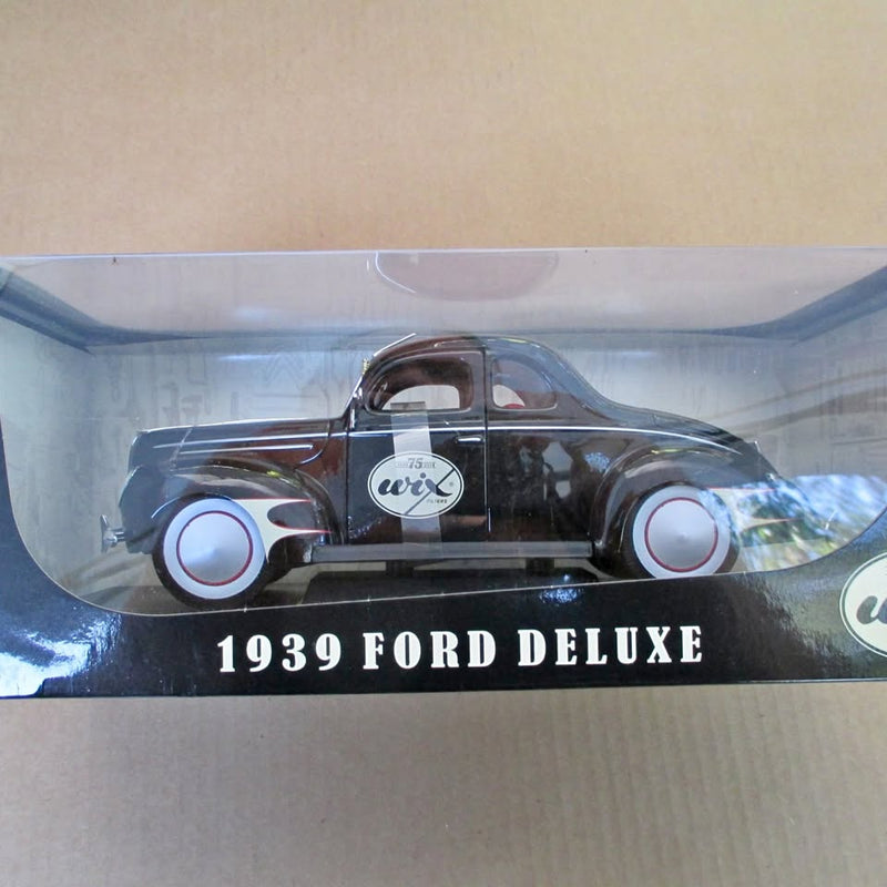 1939 Ford Deluxe diecast model car, black with silver grille and circular headlights