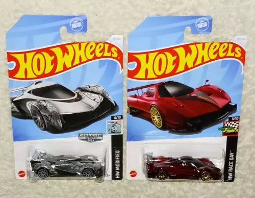 Two die-cast toy car blister packs, one black, one red
