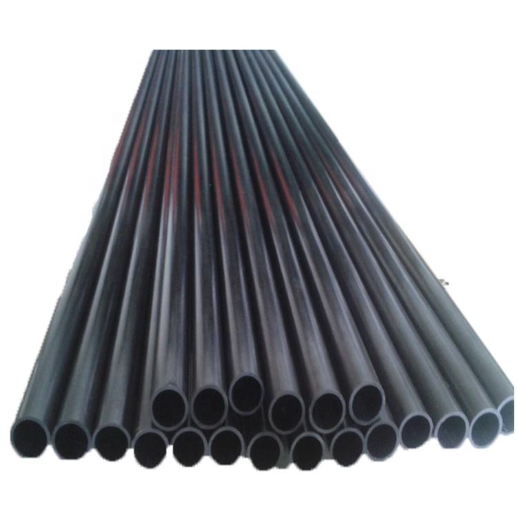 Dark carbon fiber heating tubes bundle with circular openings, close-up view