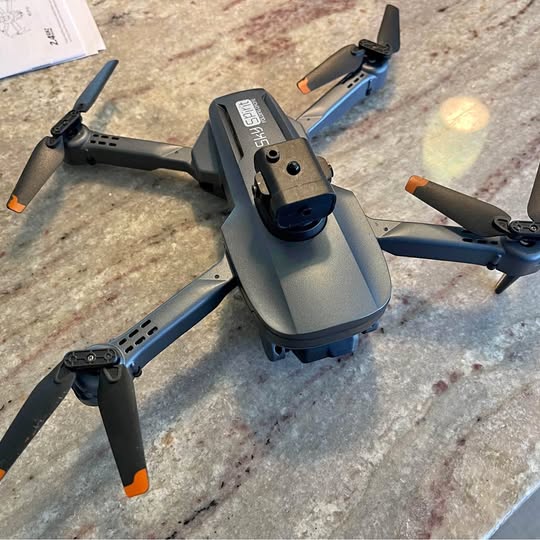 Foldable quadcopter drone with dual camera module and four propellers