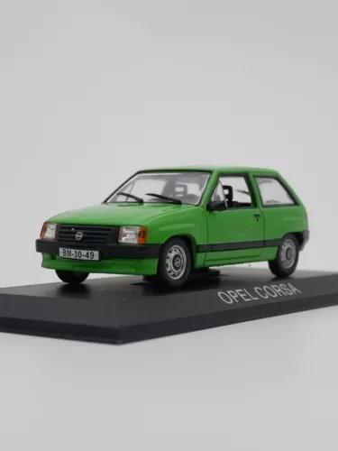 Green Opel Corsa hatchback diecast car model with display base