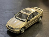 Gold Lexus IS300 diecast pullback toy car, front 3/4 view