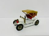 White open-top diecast model car with gold canopy and black wheels