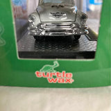 Silver 1/64 diecast classic car front view with chrome grille and headlights