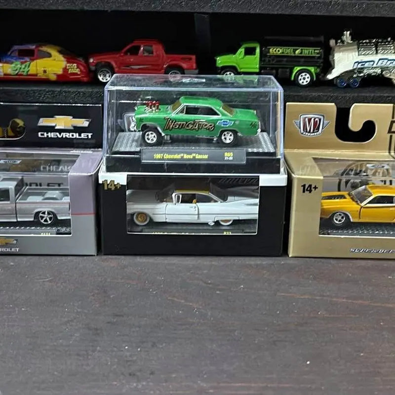 M2 diecast car, green in clear display box with 14+ badge