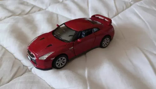Kinsmart diecast toy car, red 2009 Nissan GT-R R35 coupe model