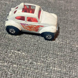 Vintage diecast toy car, white body with red flame decals and black wheels