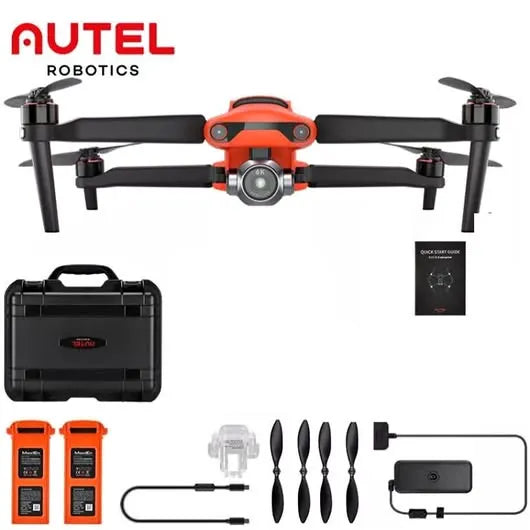 Orange and black quadcopter drone with camera, propellers, and carrying case and accessories