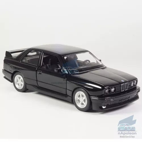 Black BMW M3 1987 diecast model car with white wheels, front 3/4 view