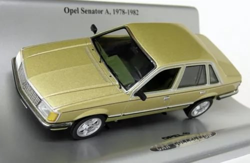 Metallic gold diecast model car, front three-quarter view with detailed interior and chrome wheels