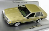 Metallic gold diecast model car, front three-quarter view with detailed interior and chrome wheels