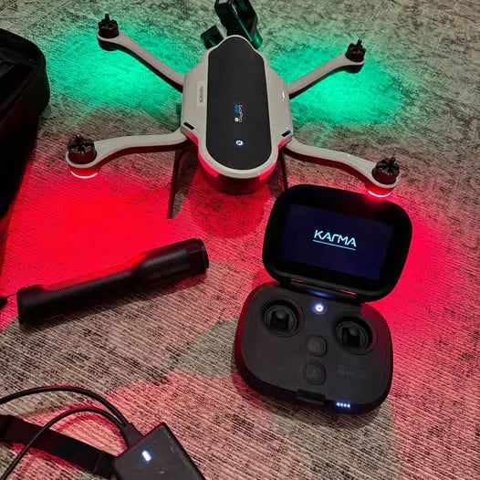 Foldable quadcopter drone and handheld remote controller with screen