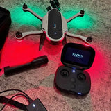 Foldable quadcopter drone and handheld remote controller with screen