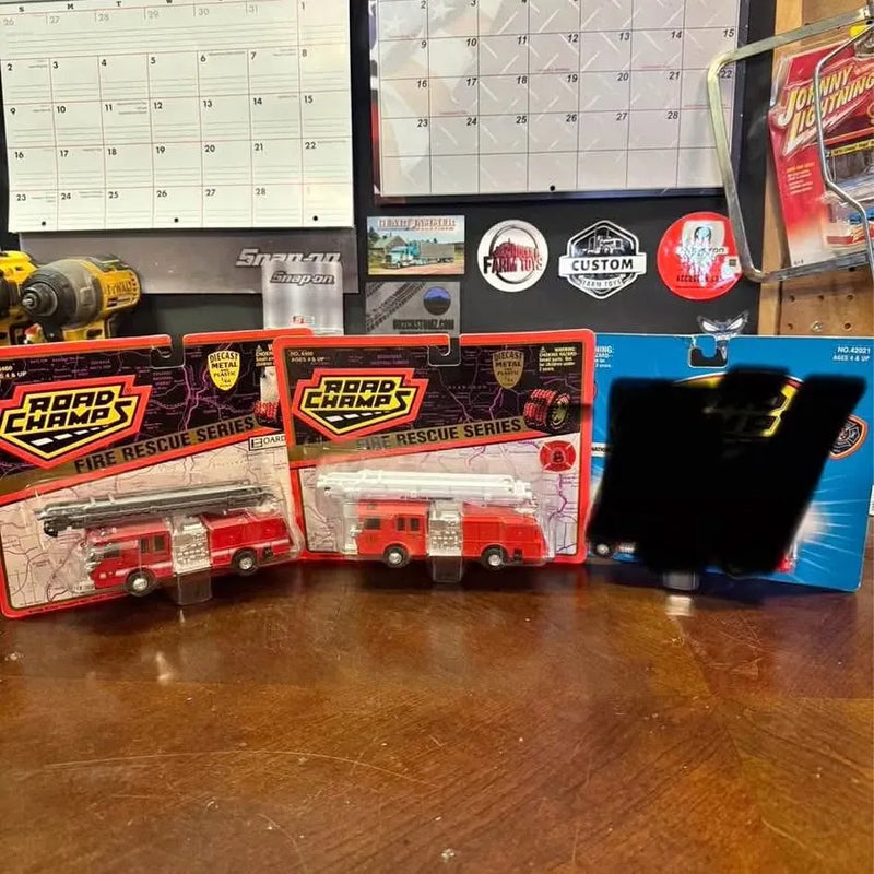 Diecast fire rescue boxed set with red trucks and black packaging