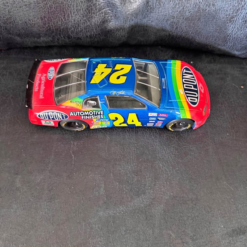 Blue #24 diecast race car with DuPont and b2 graphics, rear spoiler and chrome wheels