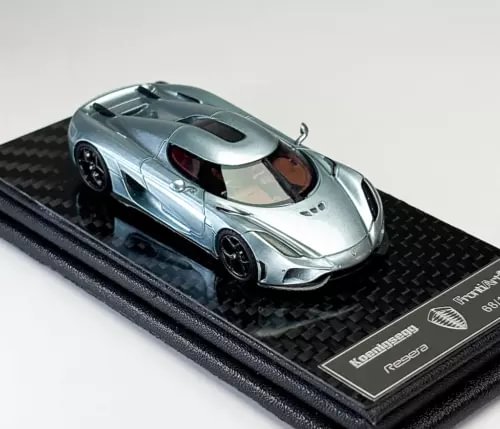 Ice blue sports racing diecast model car with hood scoop and side vents