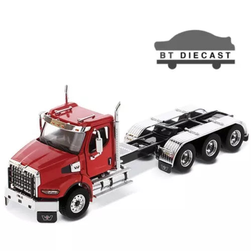 Red diecast heavy-haul day cab tractor with black flatbed trailer, front wheels and grille visible