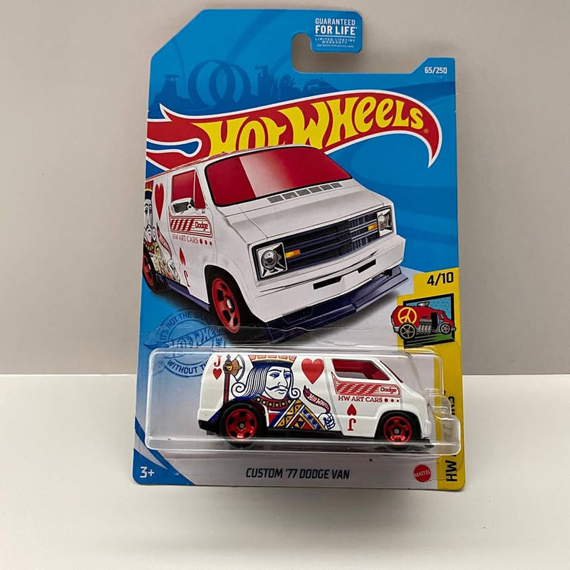 White Hot Wheels die-cast Custom 77 Dodge Van with red wheels in blister pack
