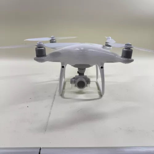Grey quadcopter camera drone with front gimbal-mounted camera and four propellers