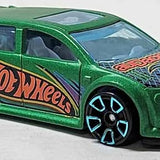 Hot Wheels diecast toy car in green with black accents and Hot Wheels logo, front 3/4 view