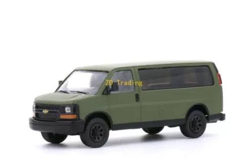 Green diecast metal delivery van model, side view with black wheels and grille.