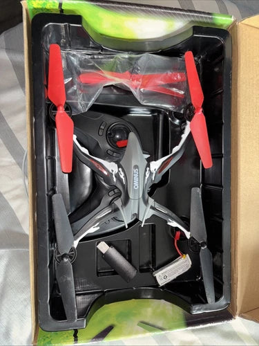Ominus drone with red propellers in black storage box