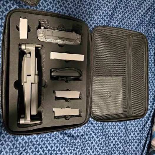 Foldable video drone accessory kit in zippered hard case with drone and controller
