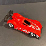 Red die-cast race car with white flame decals, black cockpit, and side exhaust