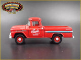 Red diecast 1:64 pickup truck model with Chevy hood and side stripe, front view